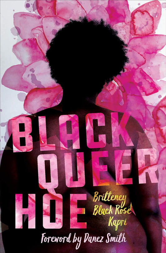 The book cover for Black Queer Hoe has an image of a fat naked black woman with her back facing us. Beautiful watercolour pink flowers overlay the image of her body, and overlay the text of the title.