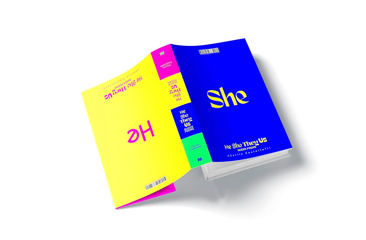 The hardback book He, She, They, Us has a reversible cover. One side of the cover is a dark blue with the pronoun "She" written in bold yellow text, while the other side has a bold yellow background with the pronoun "He" written in bright pink.