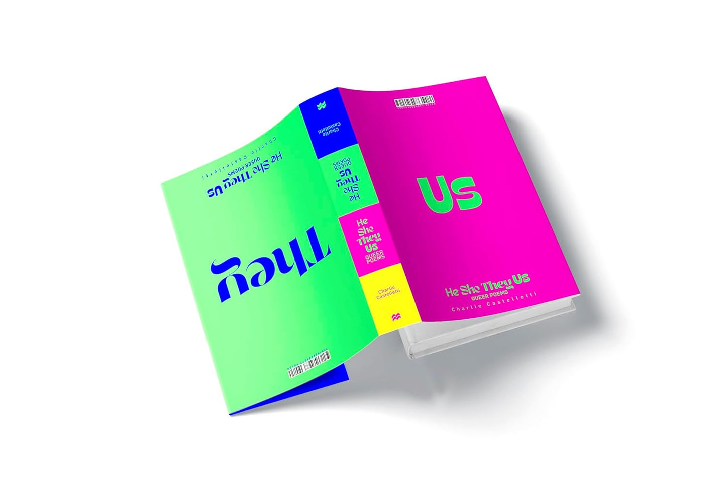 The hardback book He, She, They, Us has a reversible cover. One side of the cover is bright pink with the pronoun "Us" written in bold green text, while the other side has a neon green background with the pronoun "They" written in dark blue.
