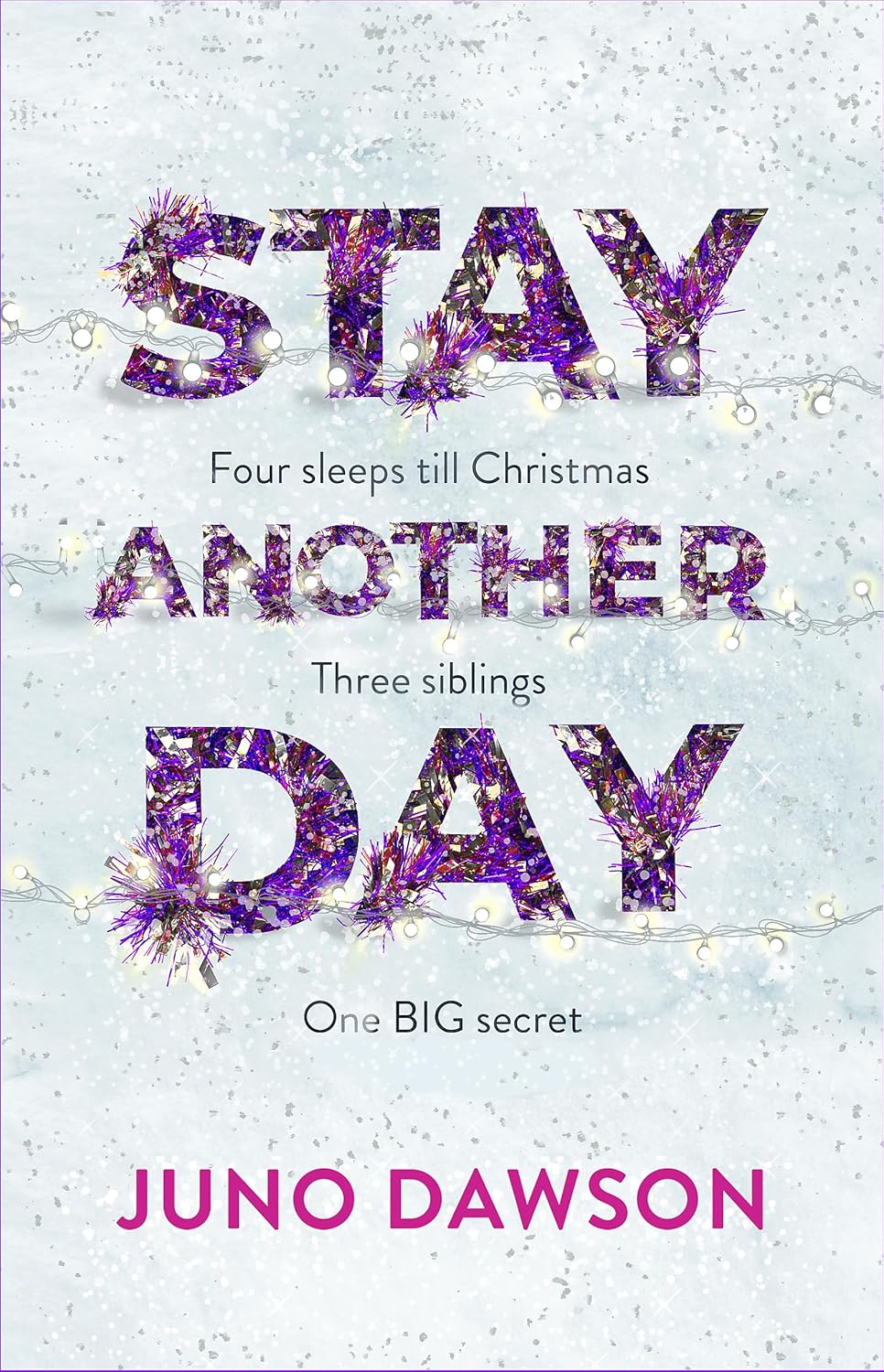 The cover of Stay Another Day is white. The title is written in large purple letters that looks like tinsel with fairy lights underneath. The book cover has lots of silver snow covering it and the authors name is written in large pink letters at the bottom.