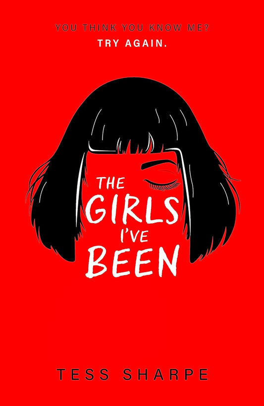 The paperback novel for The Girls I've Been has a bold red background with the illustration of a short black bob haircut in the centre, and a drawing of an eyebrow and closed eye on one side of the face. The title is written in white text on the rest of the face. Above this is a tagline that reads "You think you know me? Try again."