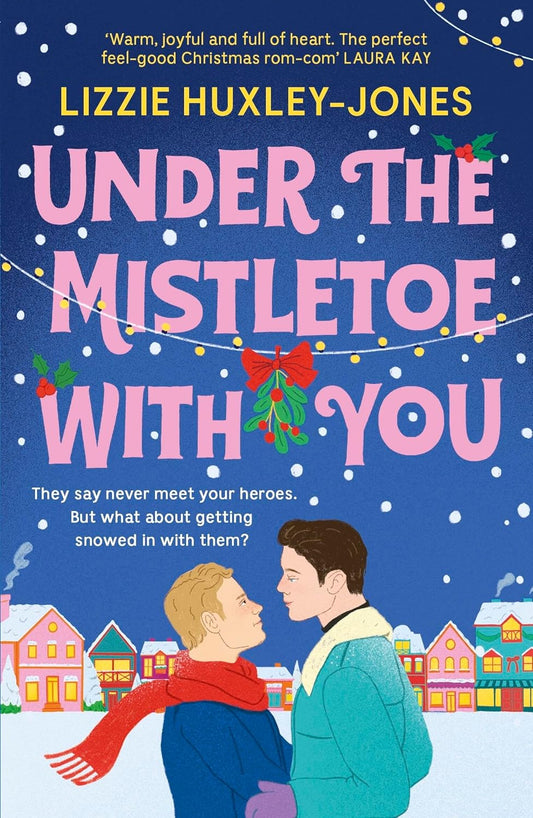 Two white men hold one another in a town covered in snow. They gaze lovingly into each other's eyes. Above them is the title of the novel "Under the Mistletoe with You" decorated with Christmas lights.